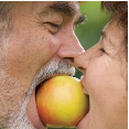 Couple Biting Apple